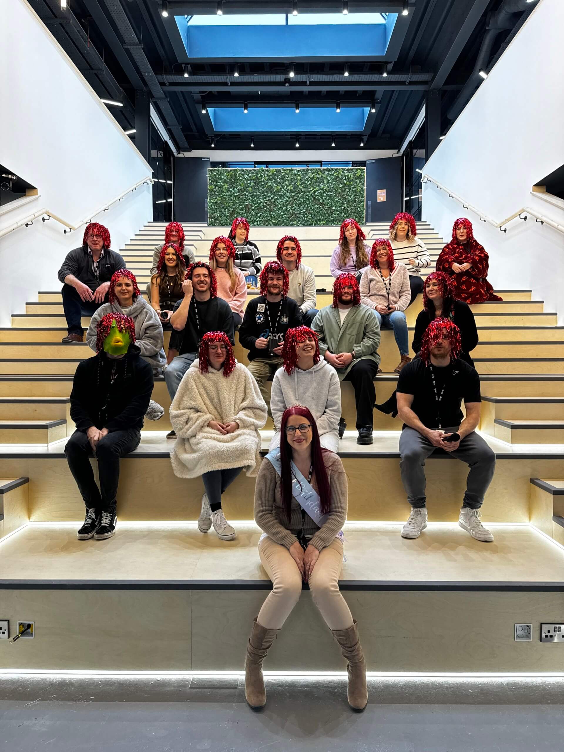 Group of people sat on stairs