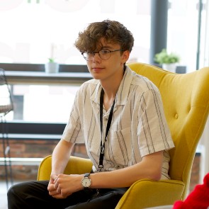 Work experience student sat talking