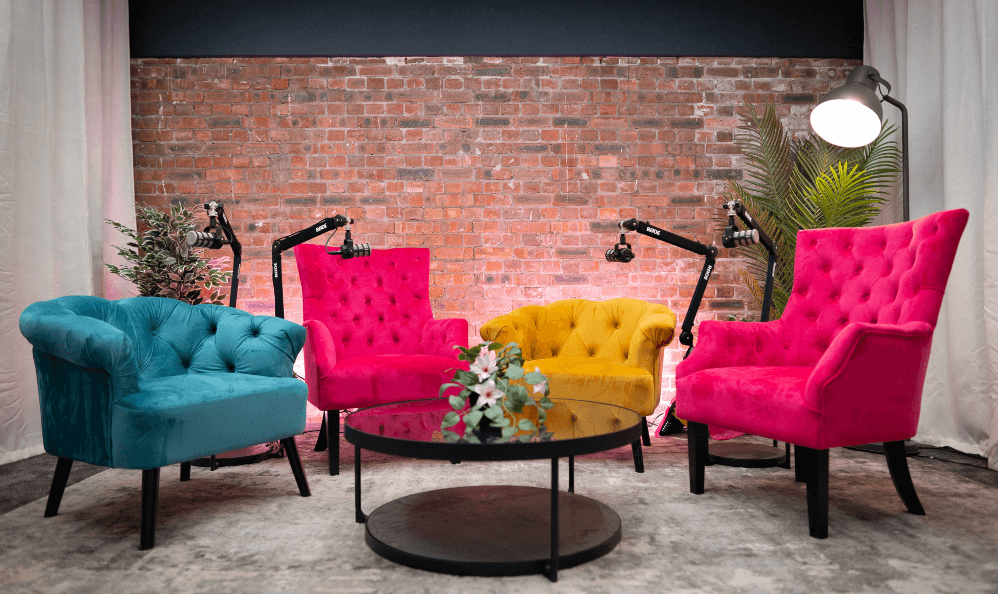 Colourful chairs set up in a podcast studio