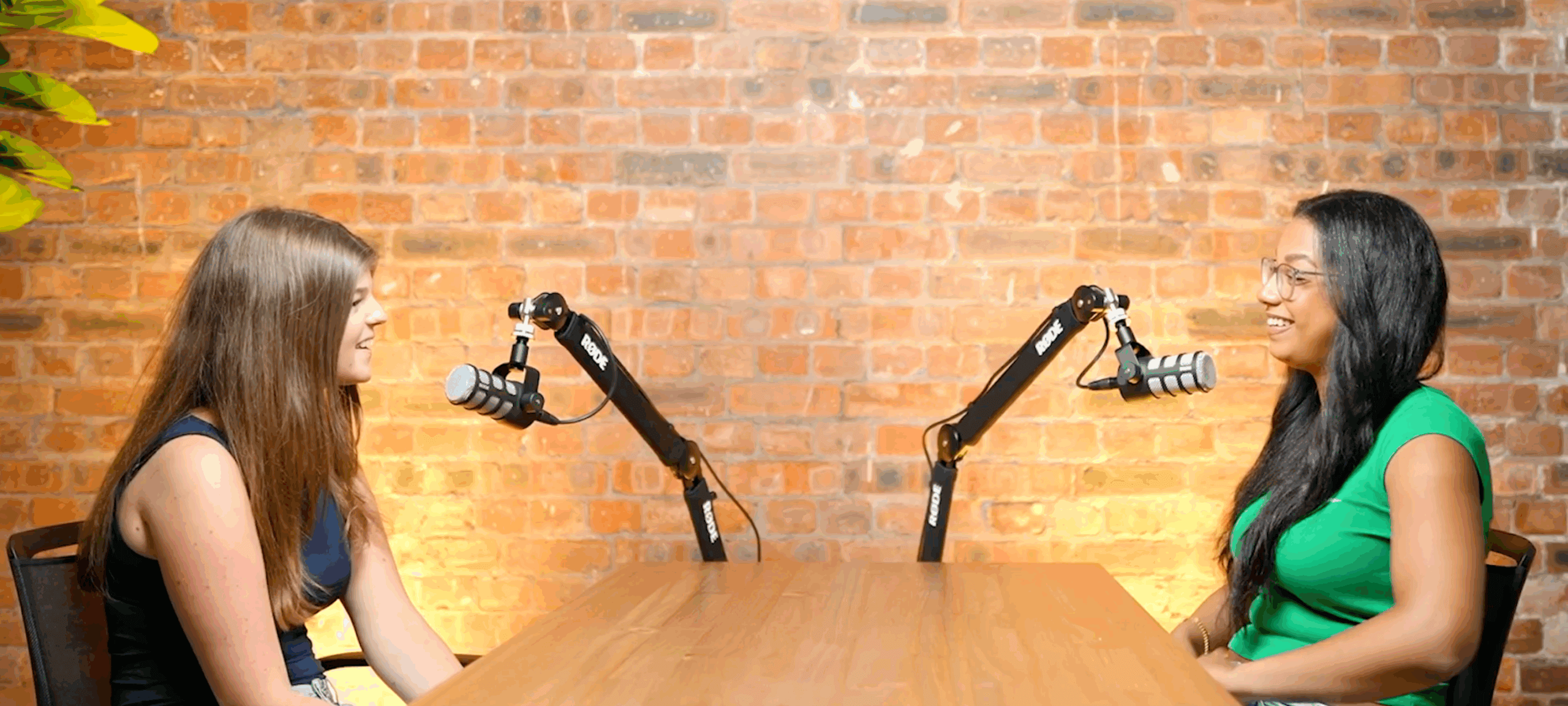 two women using podcasting equipment