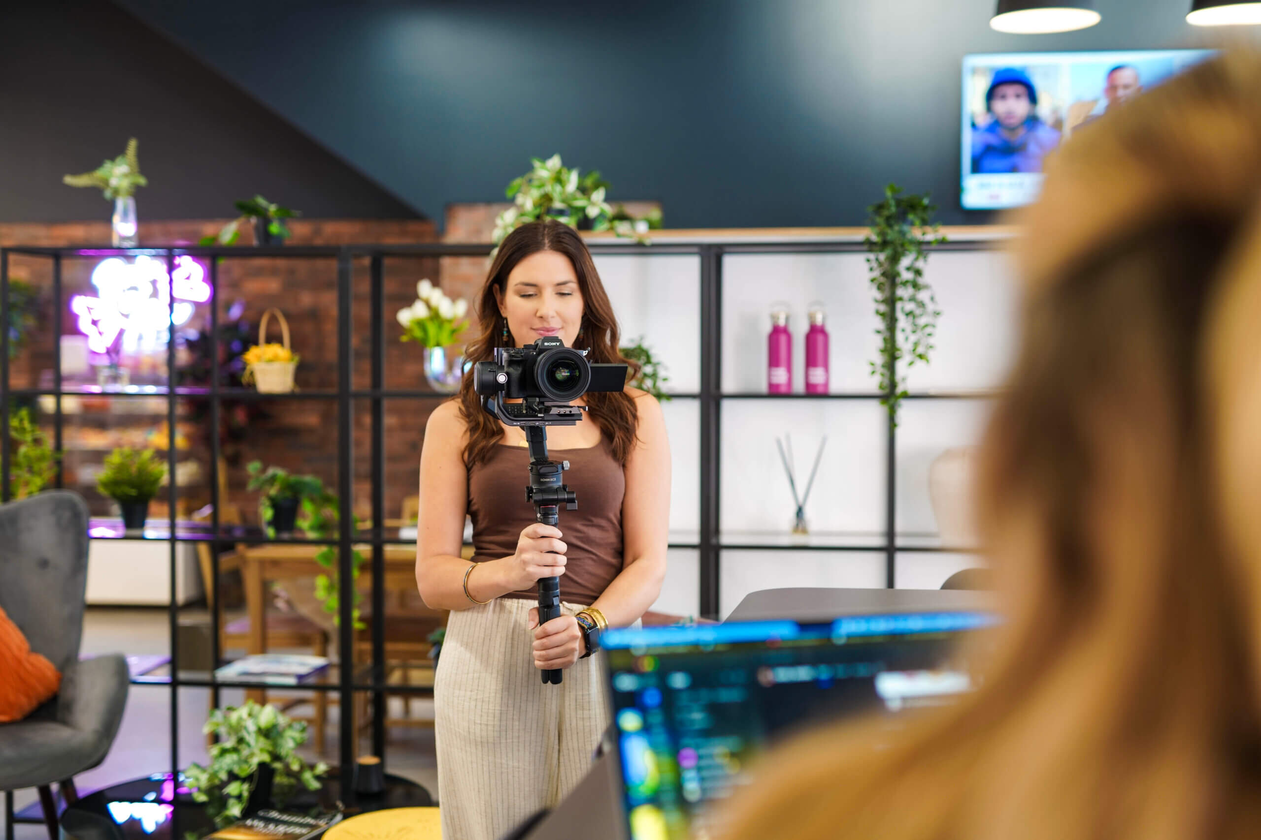 TMC videographer, Kate, filming a corporate video campiagn